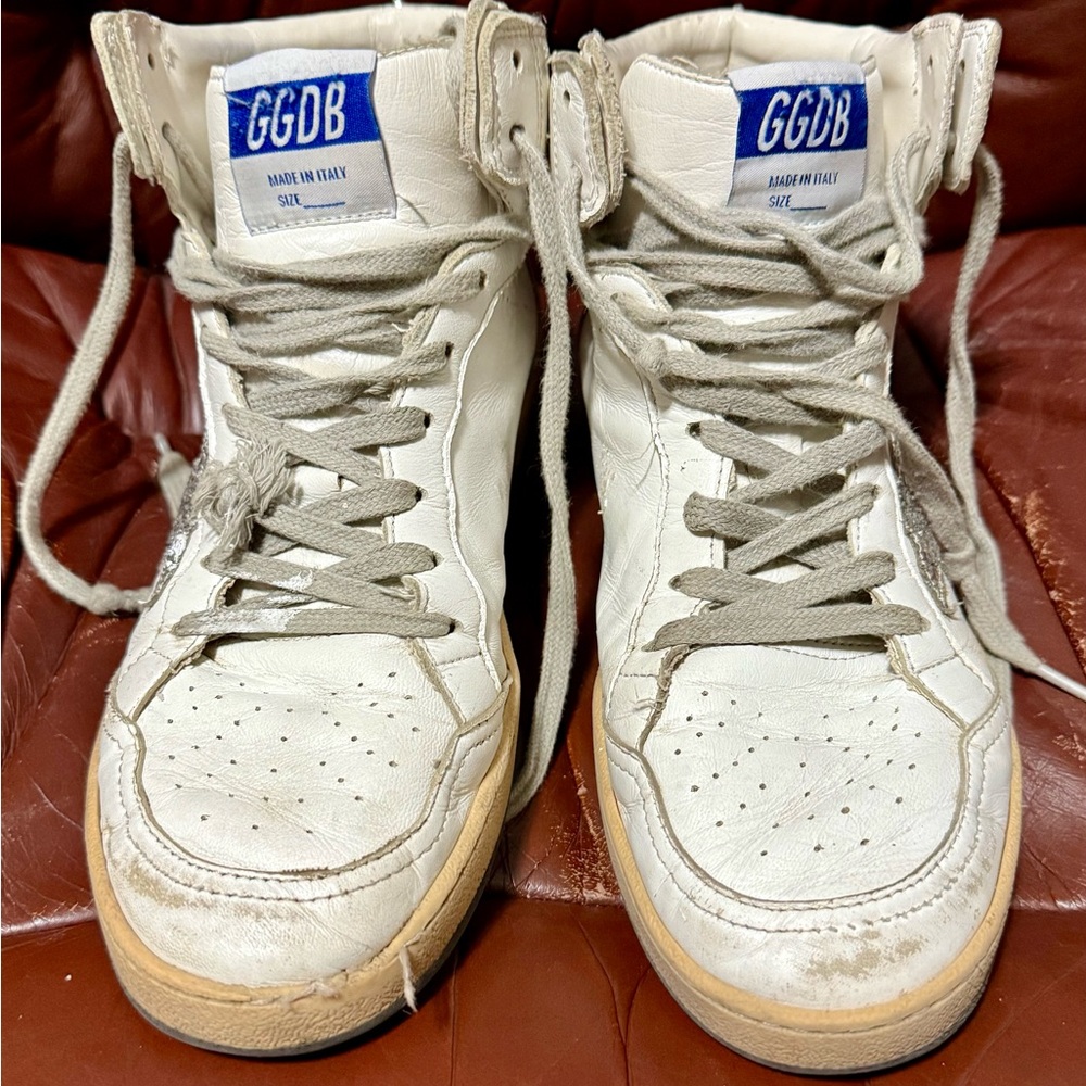 White sky star golden goose Sneakers with silver glitter star and trim.